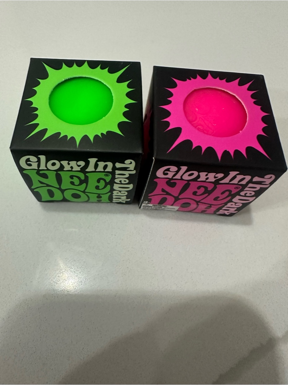 Set of 2 - NeeDoh Teenie Glow in the Dark single pack Balls - green & Pink